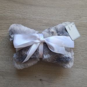 Dog bone pillow gift with white ribbon